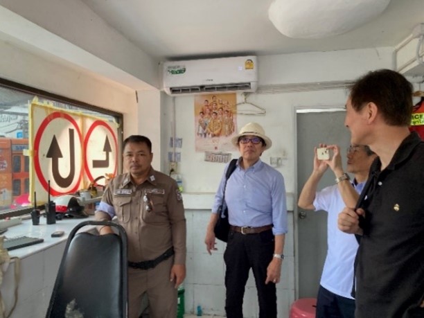 People standing inside a police box